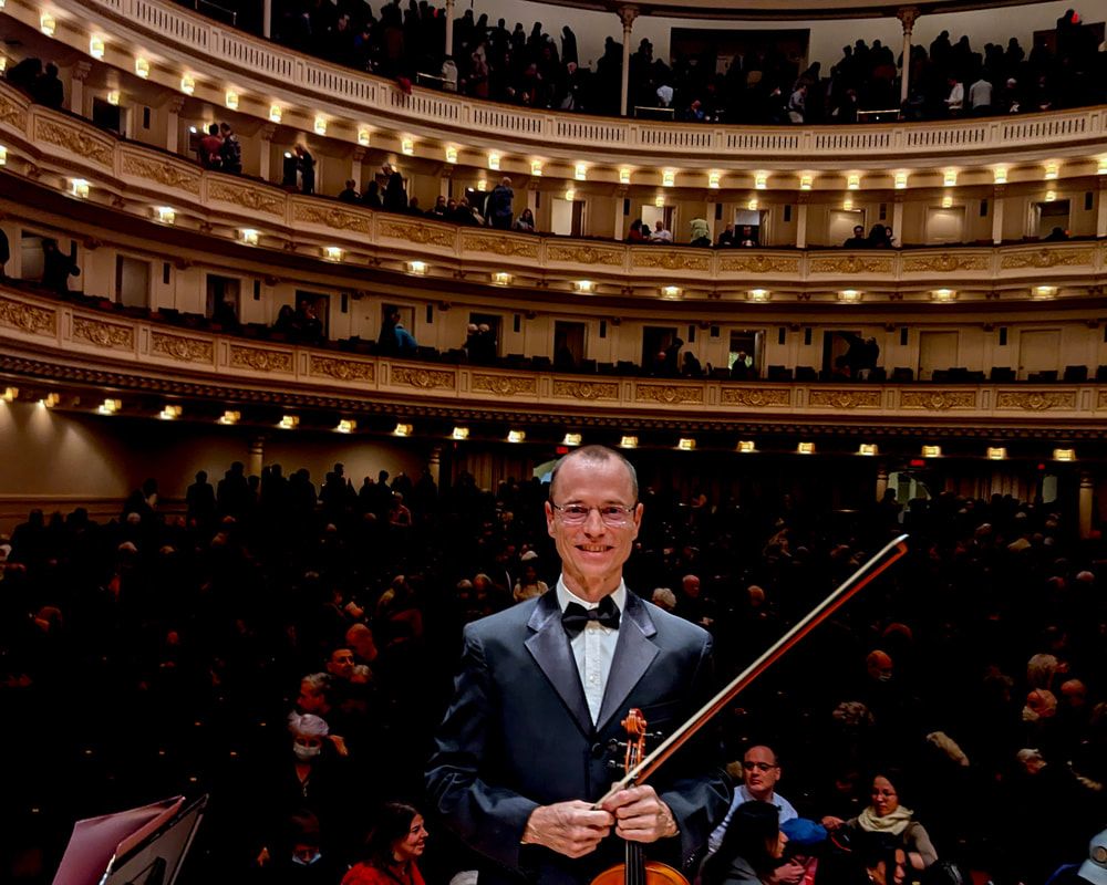 Garrett Fischbach onstage at Carnegie Hall.